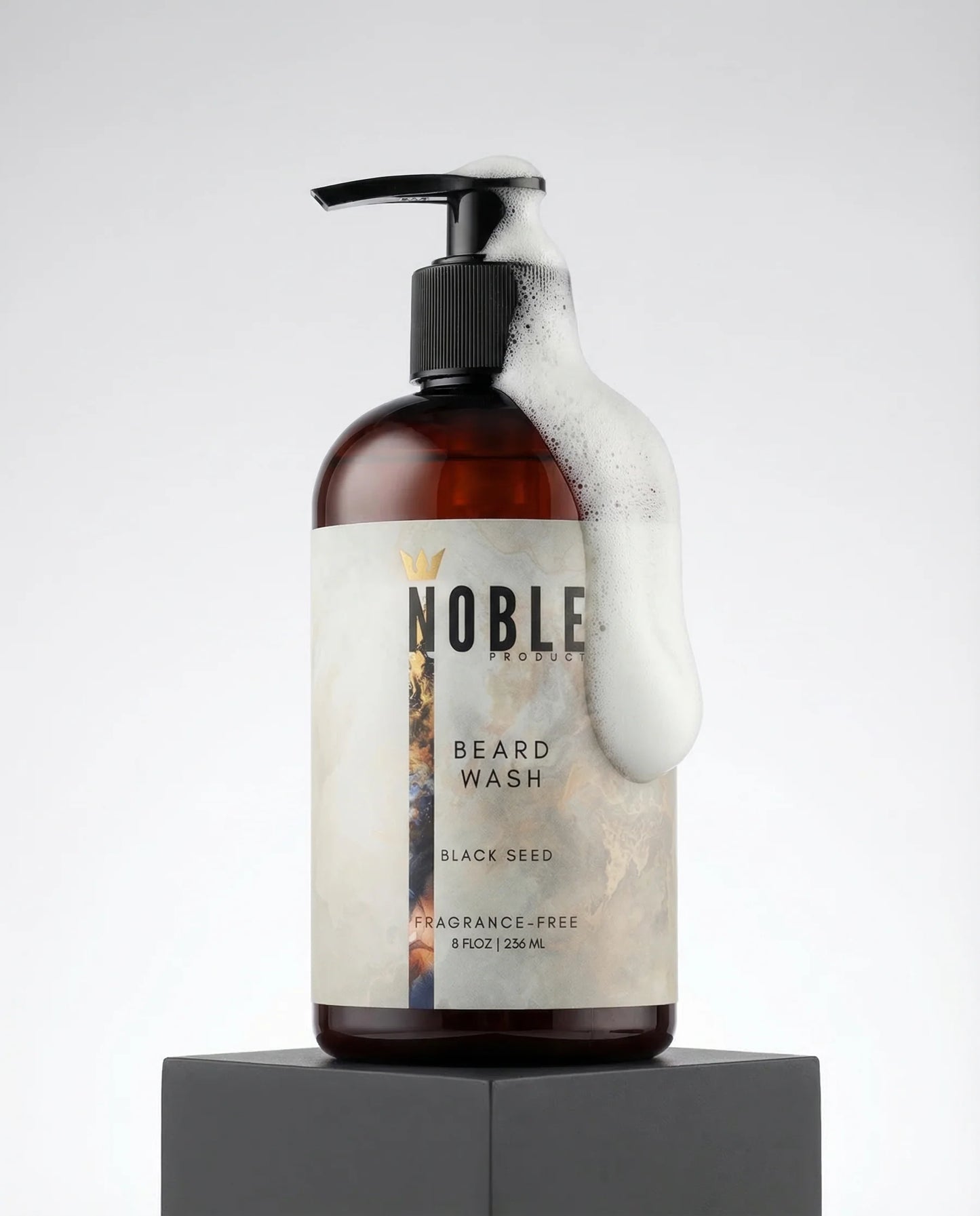 Bottle of Noble Beard Wash with a pump on a light gray background. Noble Product Fragrance-Free Beard Wash – Honeyquat, Panthenol & Cloudberry Seed Oil, 8oz