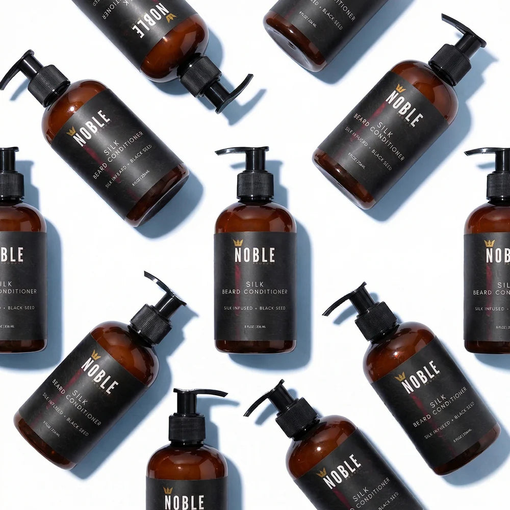 Multiple bottles of Noble Silk Beard Conditioner on a white background. Noble Product beard care lineup featuring Silk Beard Conditioner – men's grooming at Urban City Barbershop, San Antonio