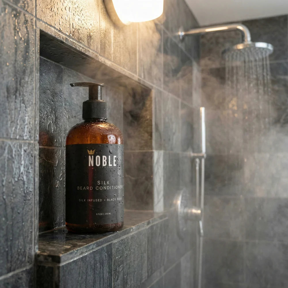 Noble Silk Beard Conditioner bottle on a shower shelf in a bathroom. Man applying Noble Product Silk Beard Conditioner – softening and detangling coarse beard hair