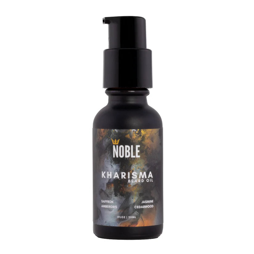 Black bottle of Noble Kharisma Beard Oil on a white background. Noble Product Kharisma Beard Oil – skin-first hydration with Jojoba, Argan & Cloudberry Seed Oil, 1oz | Urban City Barbershop